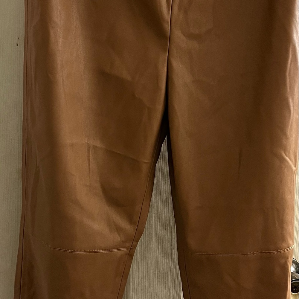 Hi rise leather leggings with side zip may fit a size down better.